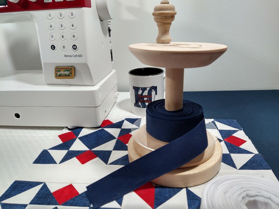 The Keystone Carving LLC Binding Buddy with quilt binding