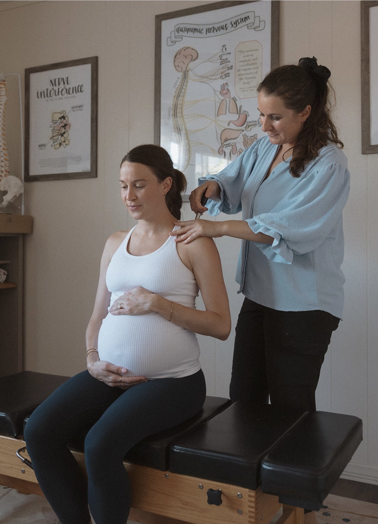 Dr. Cassandra adjusting a pregnant momma.