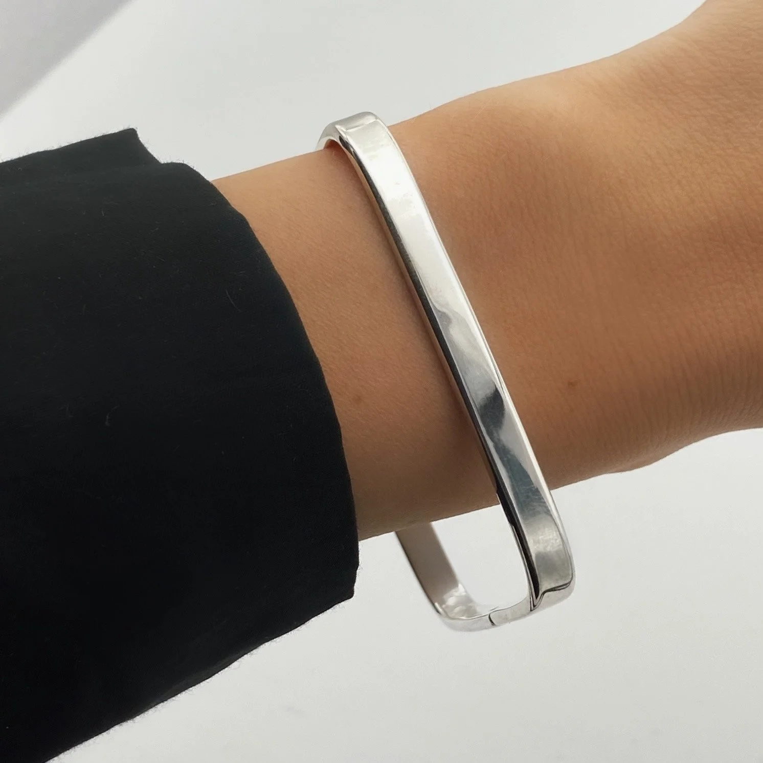 Square-shaped, solid 925 silver bracelet with snap clasp. Geometric shape and clean, modern lines. Timeless classic.
