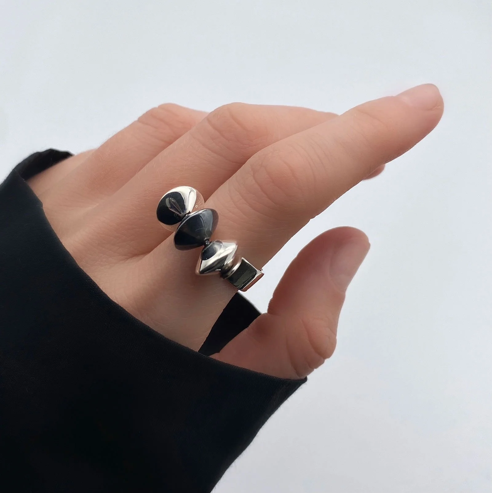 Created in unique, outstanding way, these evening ring contains three small parts in lentis shape on top of it, one is painted in a darker shade, which gives it a special touch.