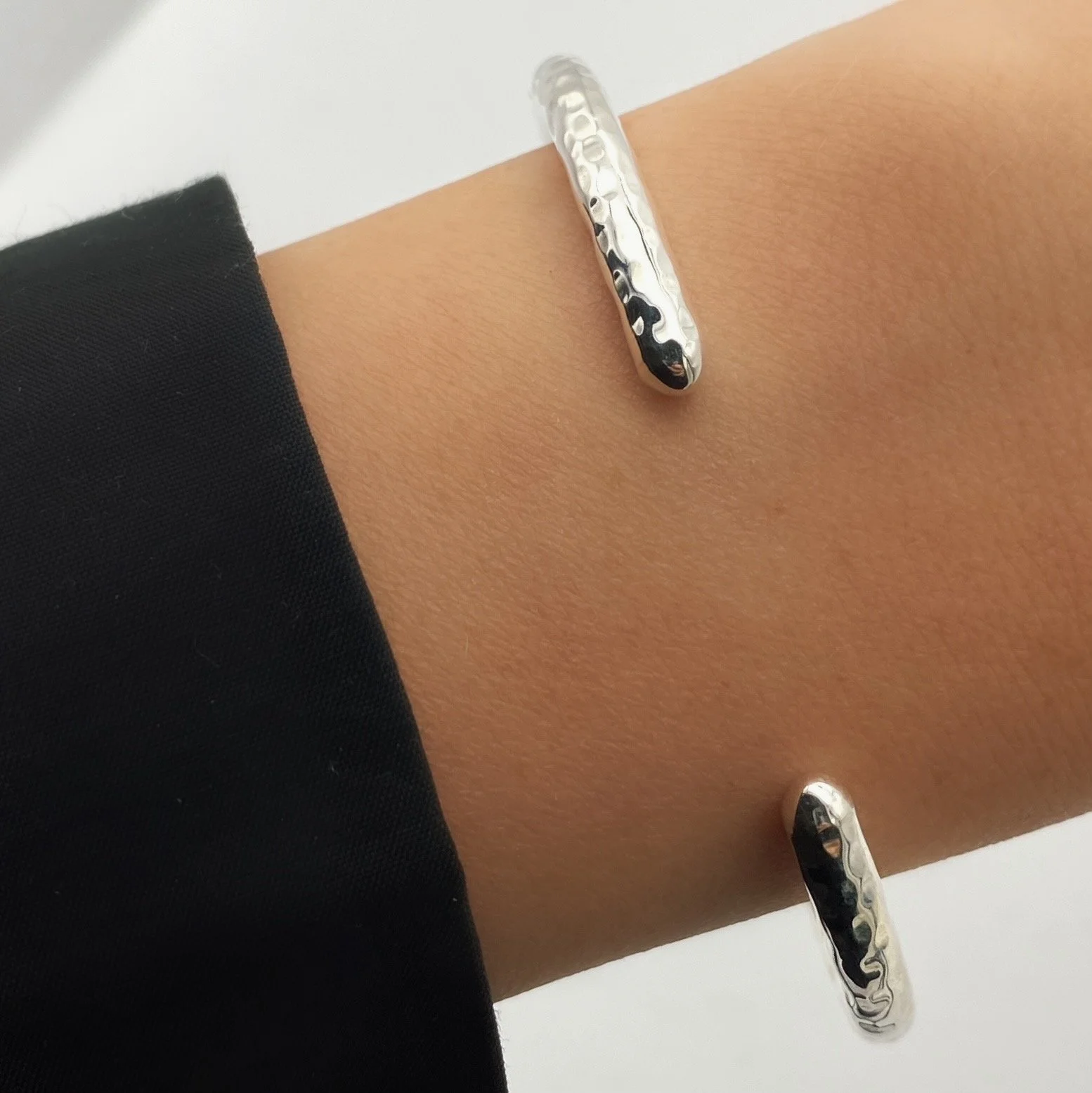 Round, open ended, cylindrical 925 silver bracelet. We took a minimalist style and made it interesting with a touch of texture.