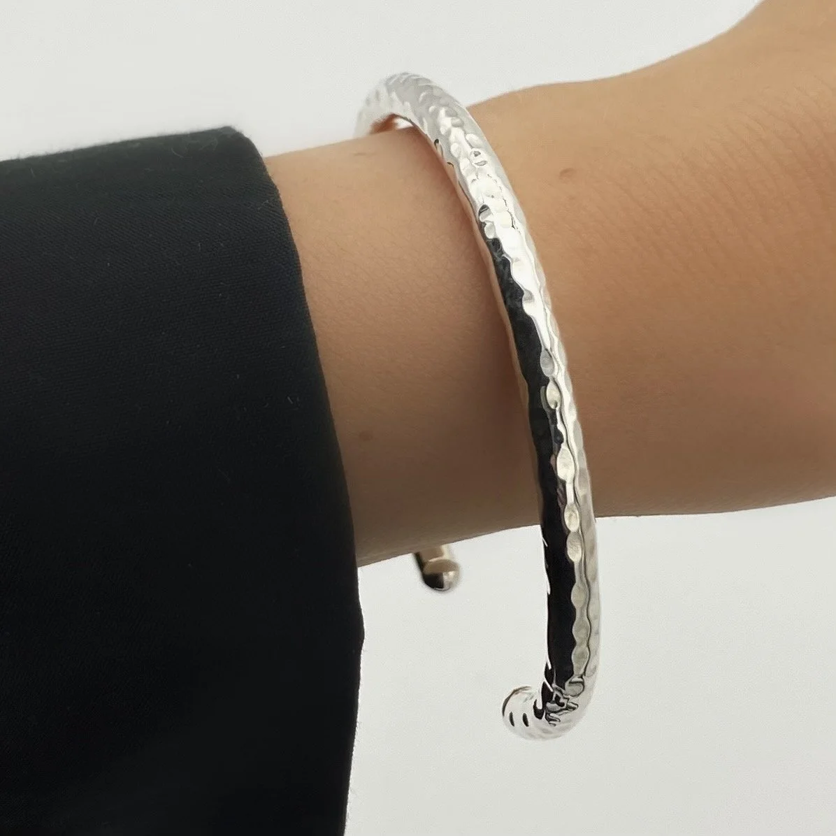 Round, open ended, cylindrical 925 silver bracelet. We took a minimalist style and made it interesting with a touch of texture.
