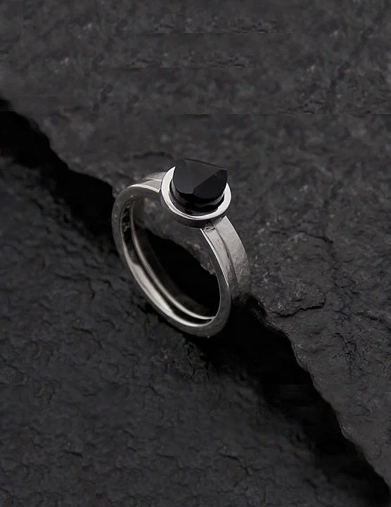 Piece, which contains two separate rings, which can be worn together as well. One is minimalist but the touch of texture and matte makes it special. Other is adorned with a faceted onyx on top of it.