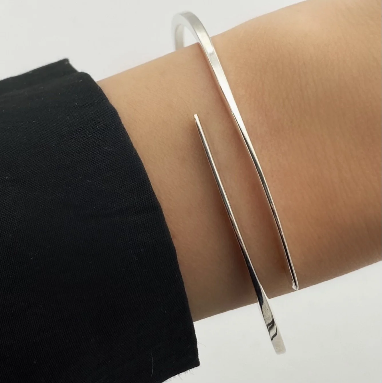Unique twist on a classic silhouette. Our Thyra bracelet is minimalist and edgy at the same time. Size is adjustable.