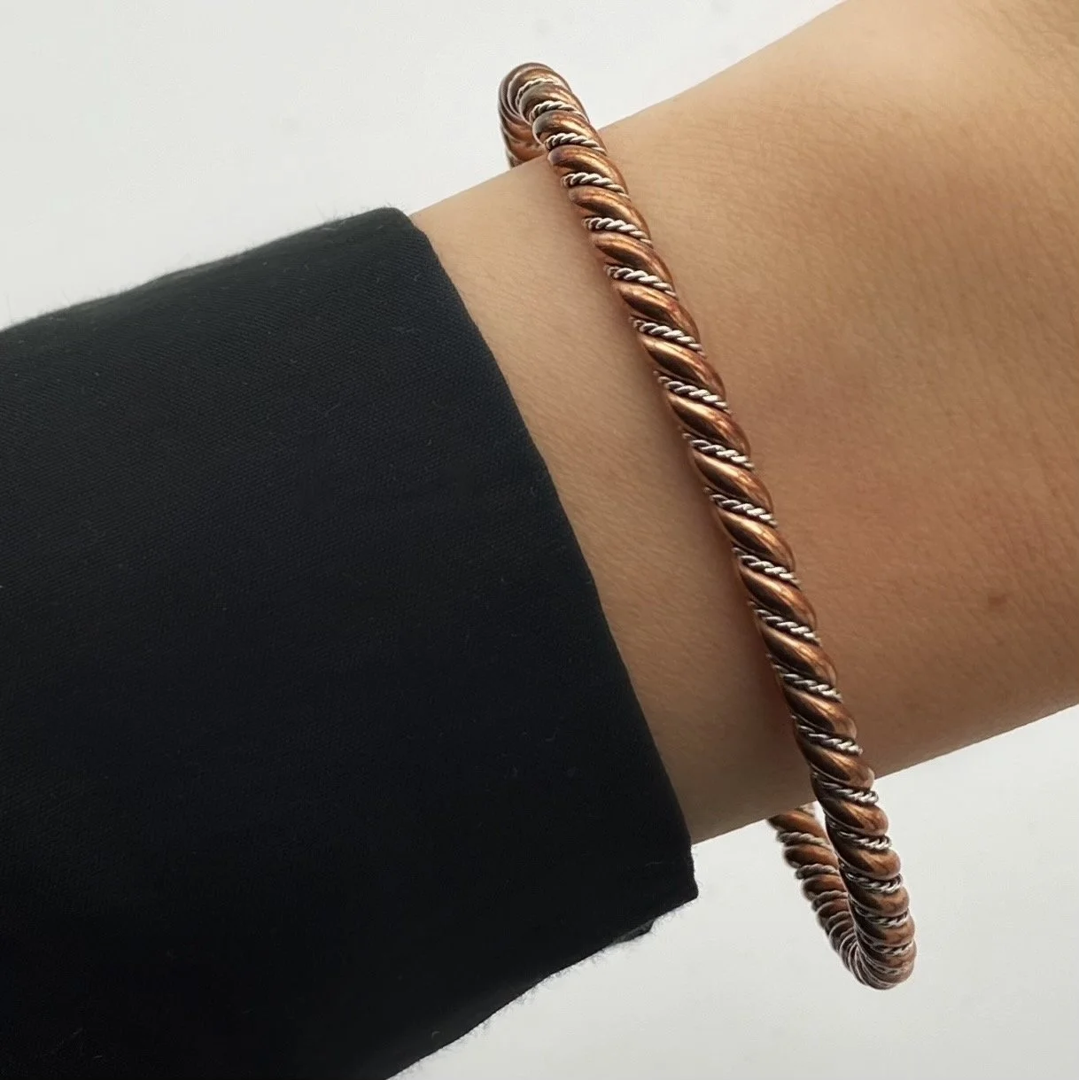 Fierce yet elegant cuff bracelet, created with interlaced 925 silver and copper. Inspired by the Viking era.
