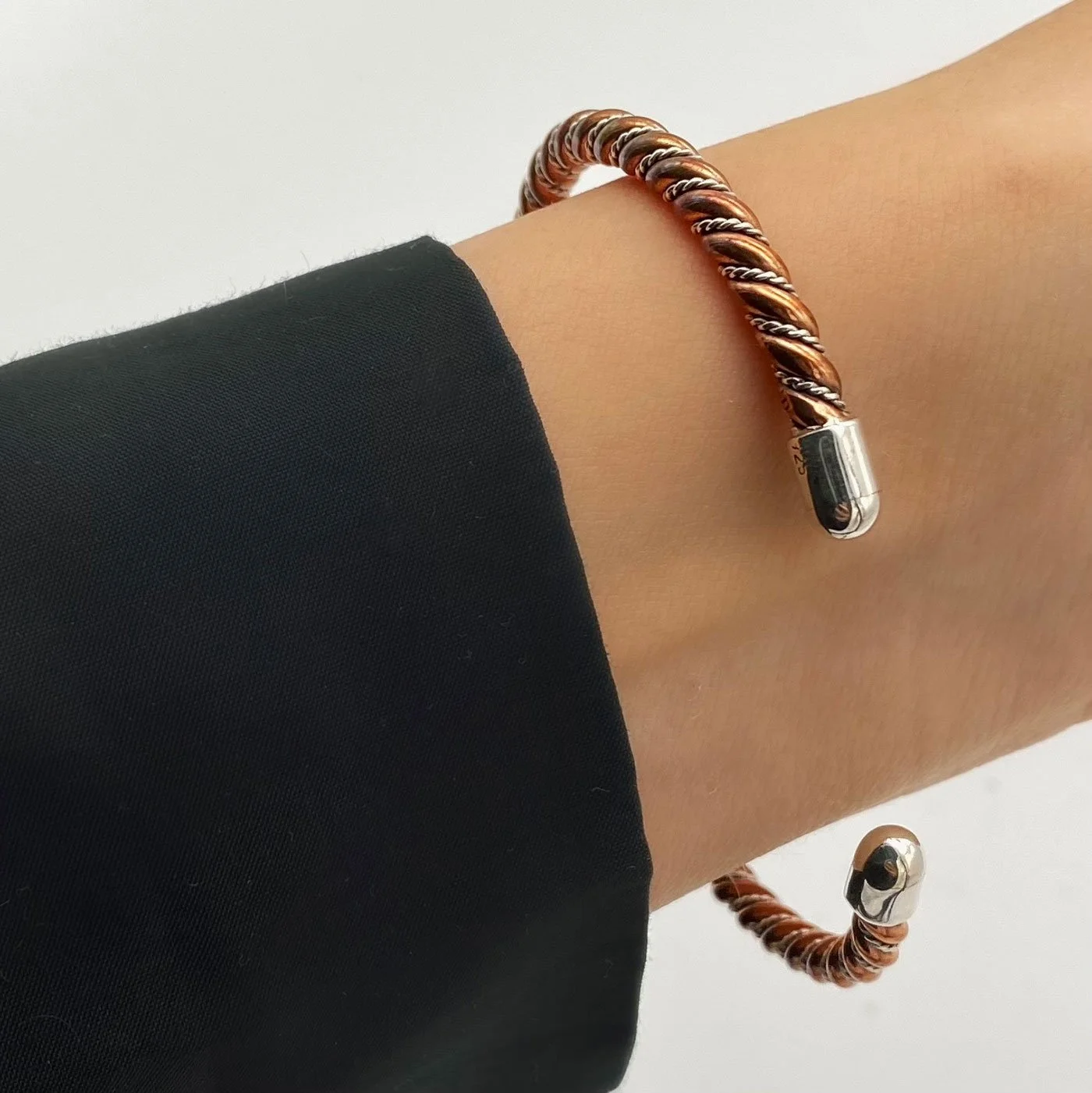 Fierce yet elegant cuff bracelet, created with interlaced 925 silver and copper. Inspired by the Viking era.