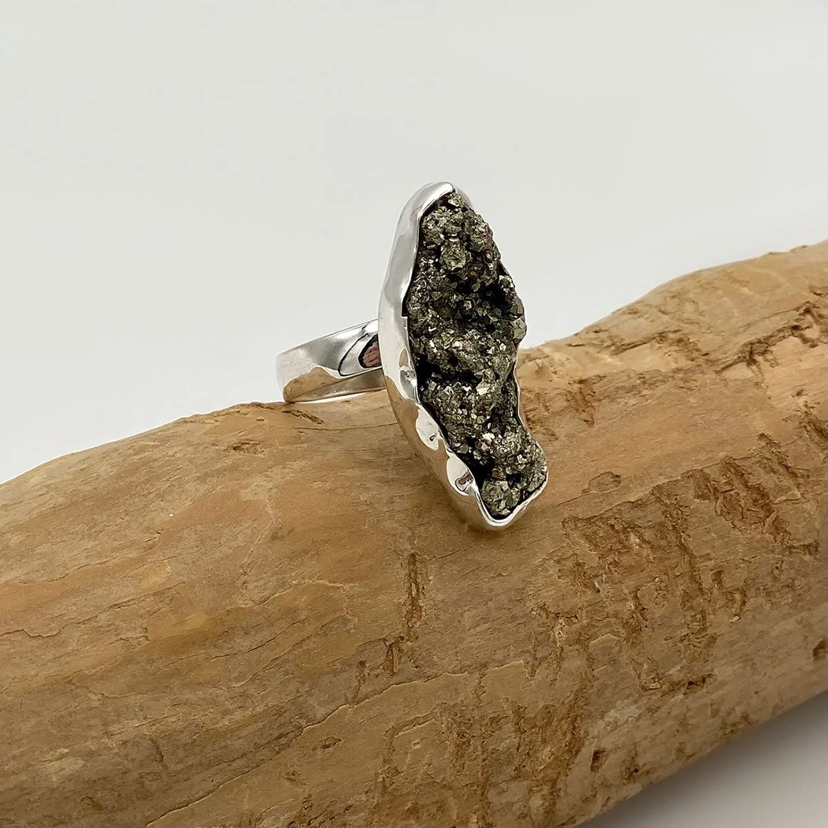 Bold, fierce sterling silver ring, adorned with raw pyrite gemstone druse. Edgy, eye-catching, dramatic, yet very stylish and hypnotic. Size is adjustable.