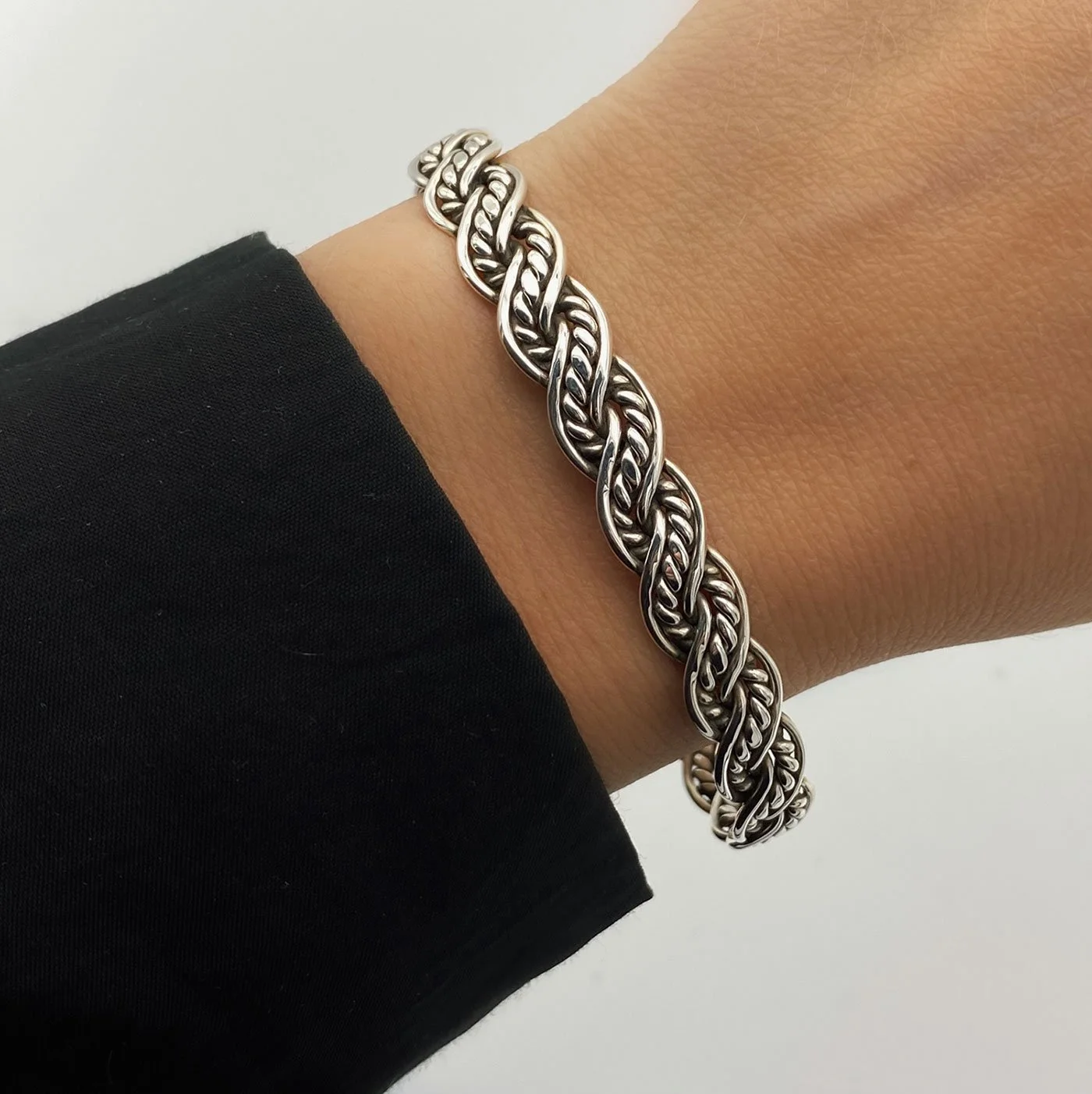 Silver cuff bracelet, inspired by ancient Viking era jewelry. The interwined parts of the bracelet give it an antique, vintage look.