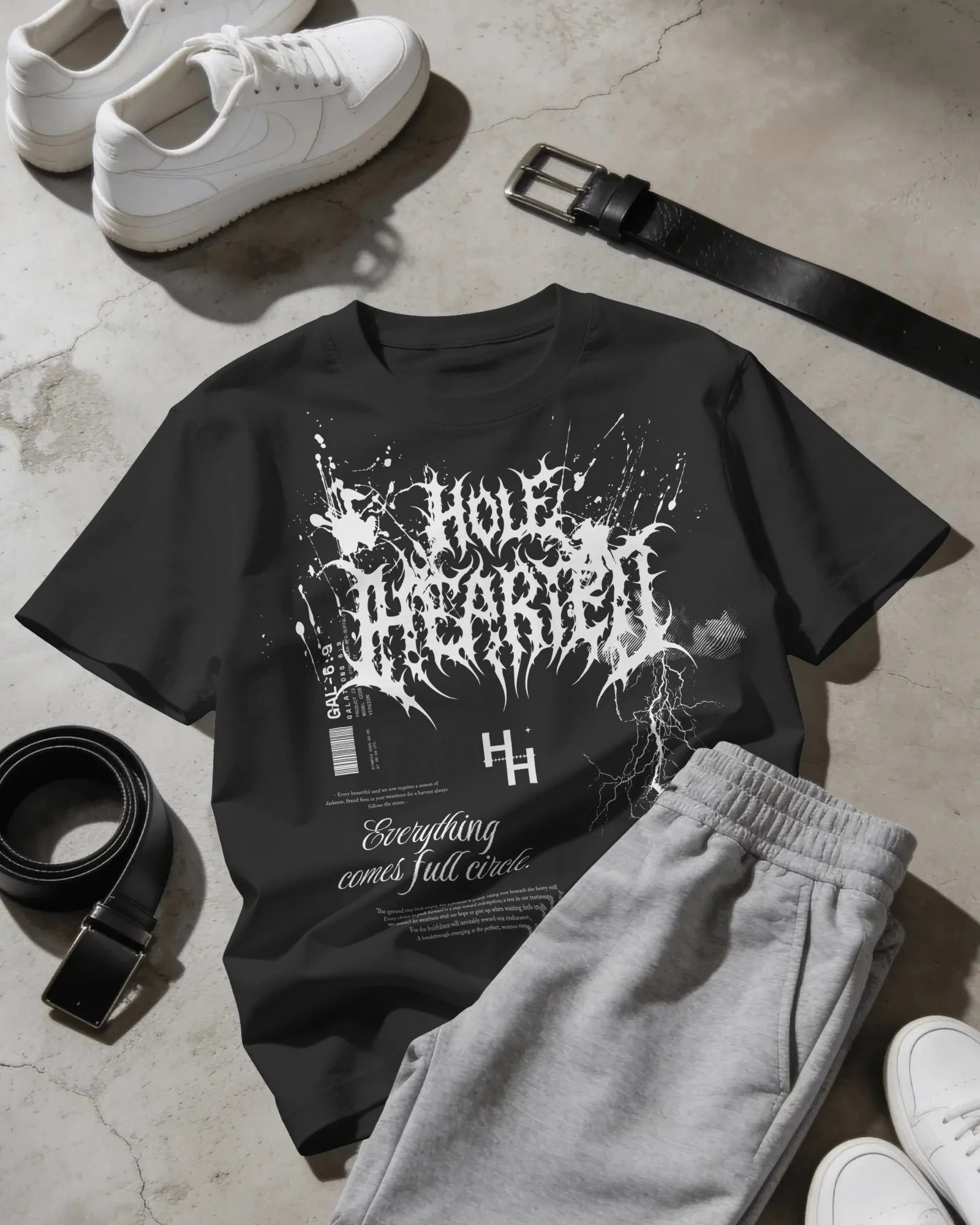 flat-lay-t-shirt-mockup-with-sweatpants-sneakers-and-belts-on-concrete-floor-04298.jpg