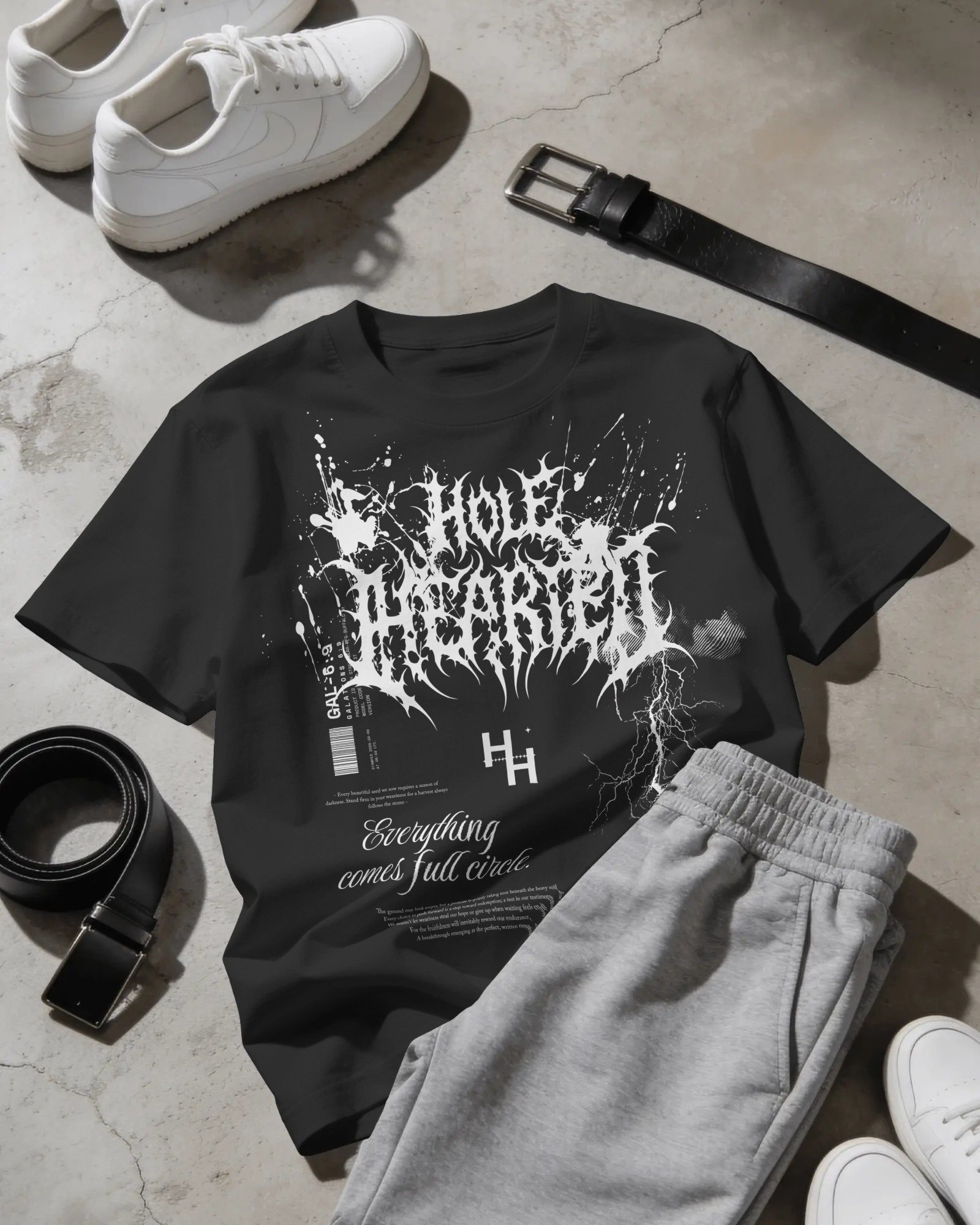flat-lay-t-shirt-mockup-with-sweatpants-sneakers-and-belts-on-concrete-floor-04298.jpg