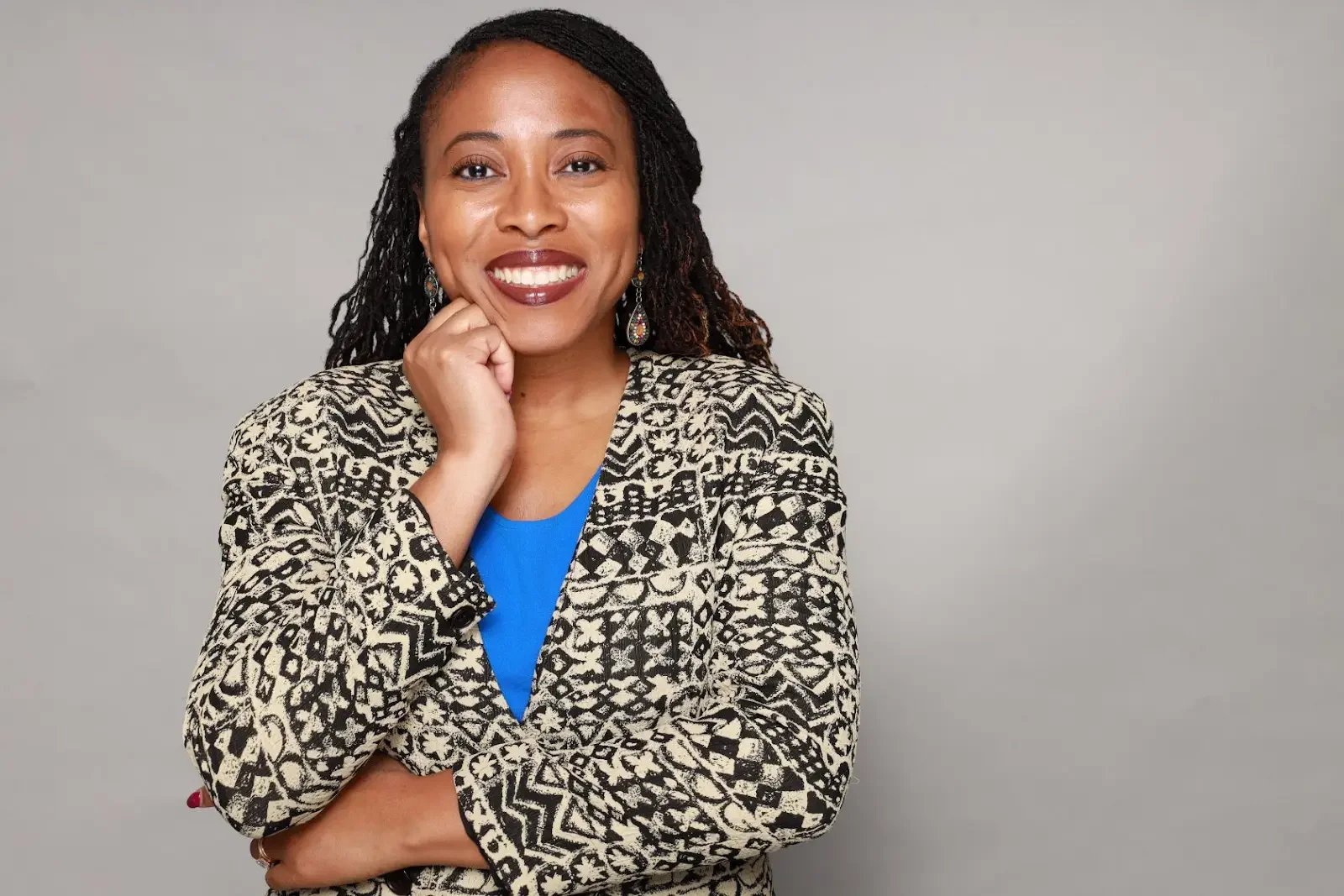 DR NAE headshot blazer smile website.webp