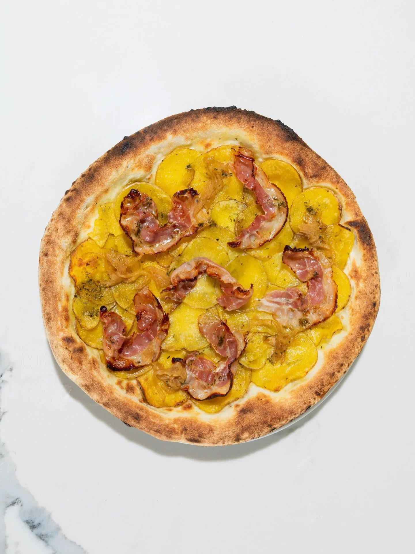 The Patata Pizza - Potatoes, Fior di Latte, Pancetta &amp; Caramelized Onions

#VivoAvanti #Patata #Pizza #torontorestaurants #vivo #torontoitalian