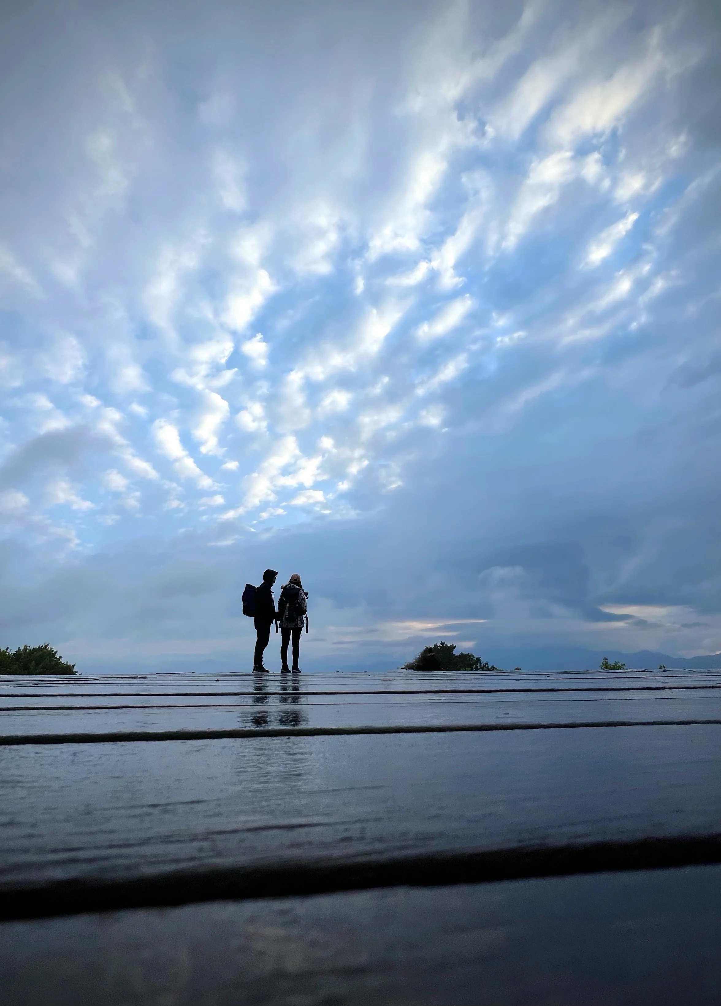 [Keith Haring @ Alishan!]
Quiet moment after seeing the sunrise on Alishan (Taiwan) from the Xiaoliyuanshan Lookout platform. Most folks left but there was an epic cloudscape + reflective wet surface that setup a moody canvas. The girl in the shot wo