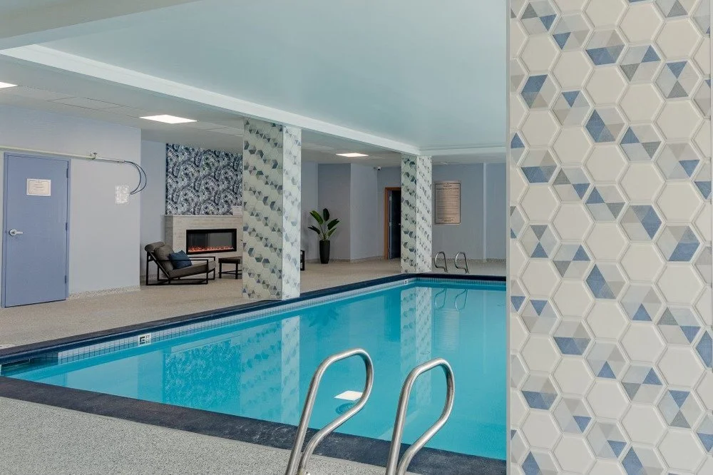 0049-amenity-pool-hex-tile-fireplace-lounge.jpg