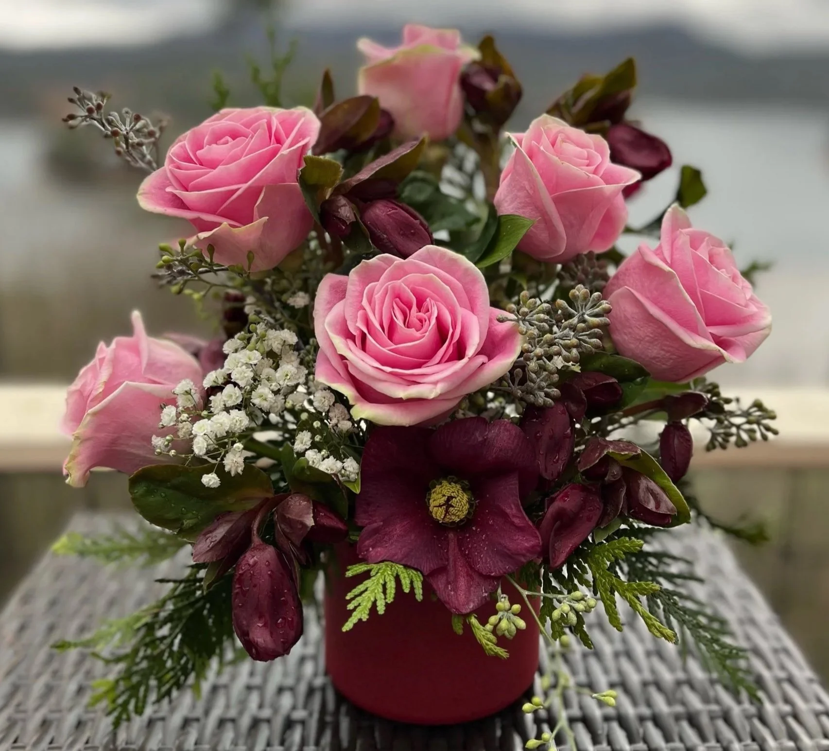 Petite Valentine's Day floral arrangement highlighting soft blooms and cute styling.