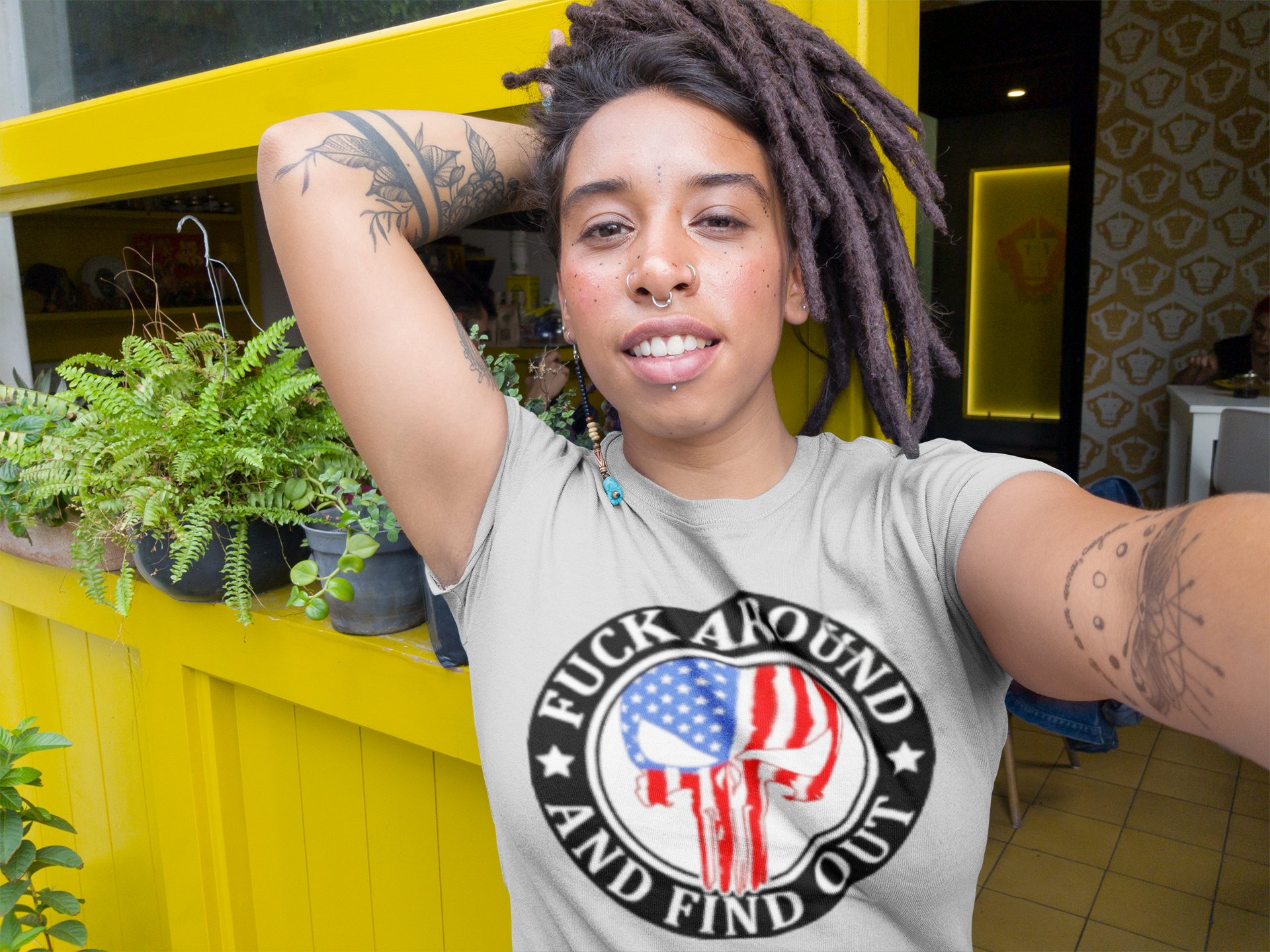 urban-black-girl-with-dreadlocks-wearing-a-tshirt-mockup-while-taking-a-selfie-near-a-yellow-window-a17143.png