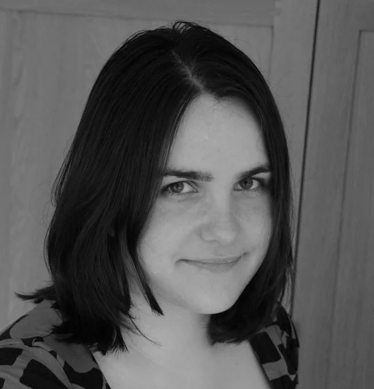 Black and white headshot of Audree Fletcher - a white woman with mid-length dark hair