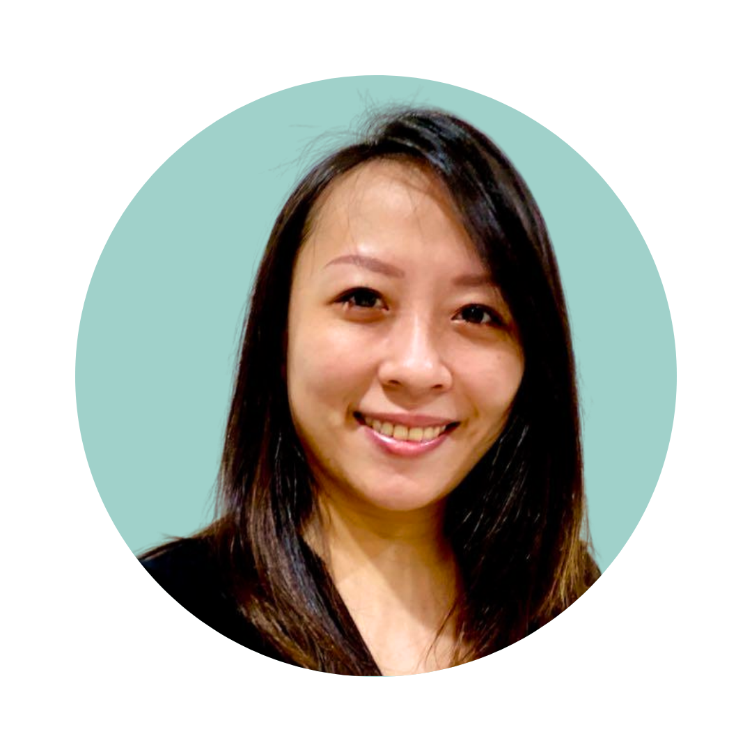 Black-and-white portrait of a woman smiling with straight dark hair