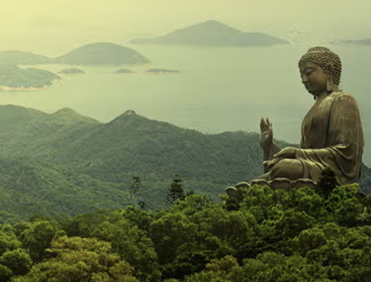 Ancient Indian rock-cut cave temples with intricate carvings and statues, bustling with visitors.