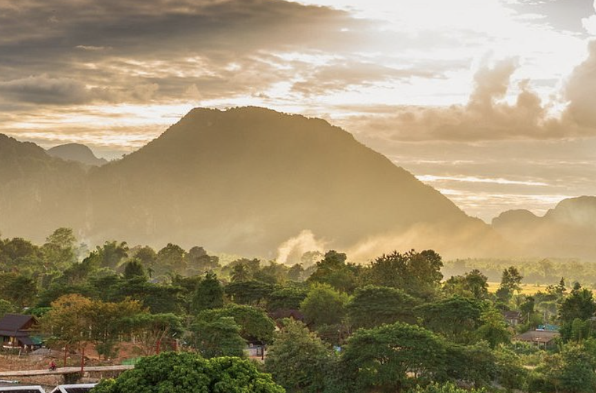 Ancient carved stone relief of a woman with jewelry, surrounded by other figures and detailed carvings.