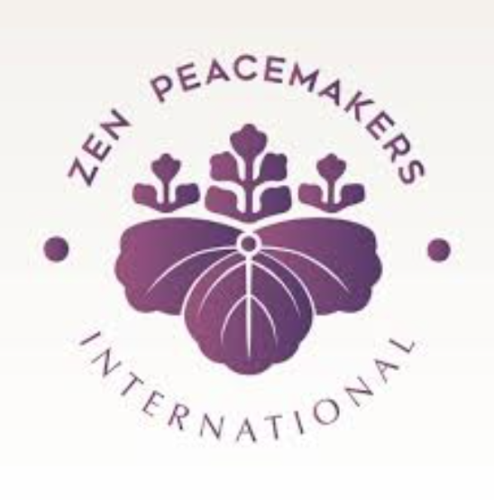 Logo of Zen Peacemakers International featuring a butterfly with purple hues and stylized tree branches above it, with the organization name encircling the design.
