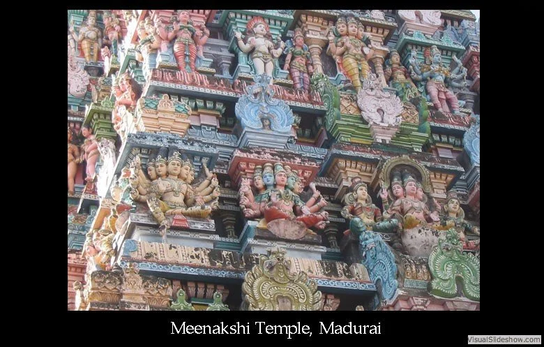 Colorful detailed sculptures of Hindu deities and mythological figures adorn the exterior of Meenakshi Temple in Madurai, showcasing intricate craftsmanship.