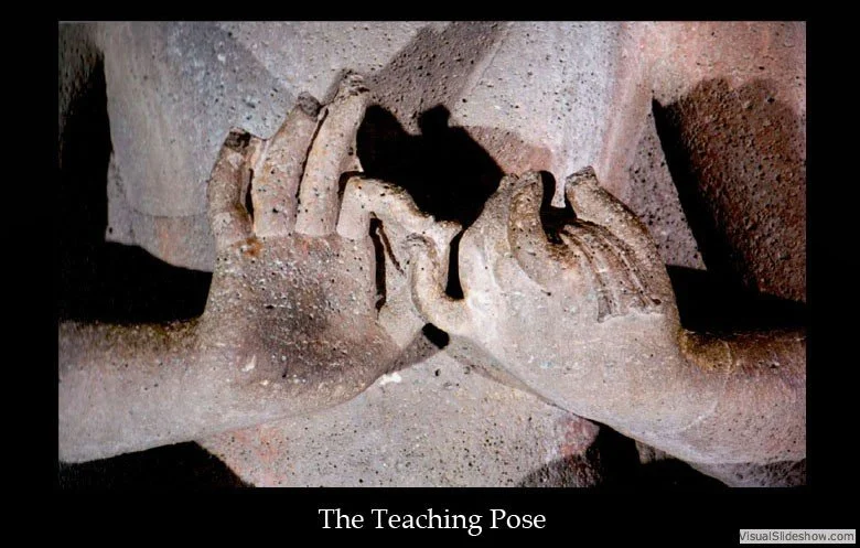 Ancient carved stone sculpture depicting two hands in a teaching pose, with one hand holding the other in a supporting gesture.