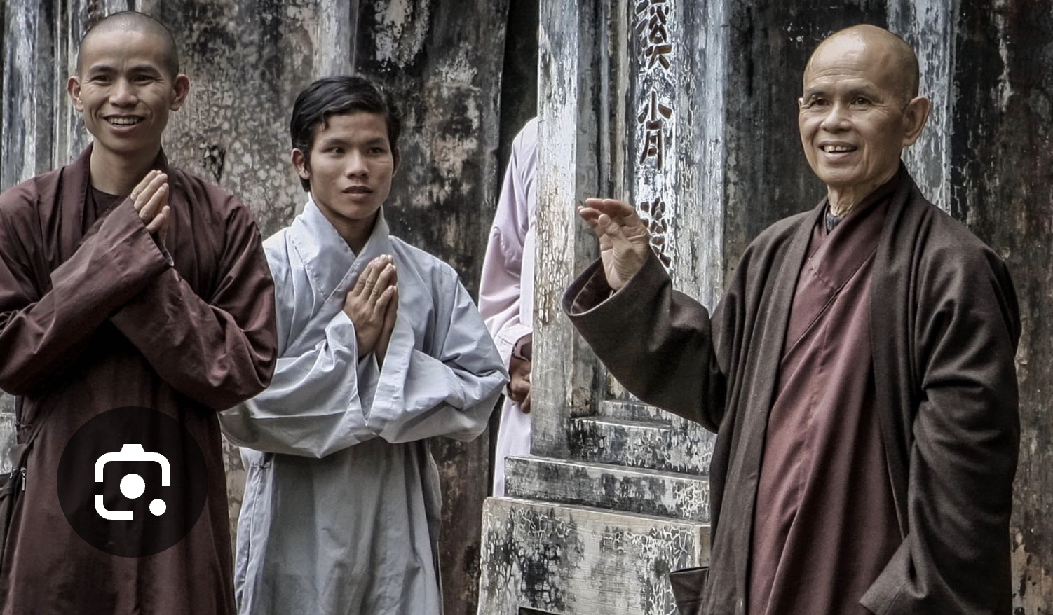 Ancient brick temple ruins surrounded by greenery with worn stone stairs leading up to the structure.