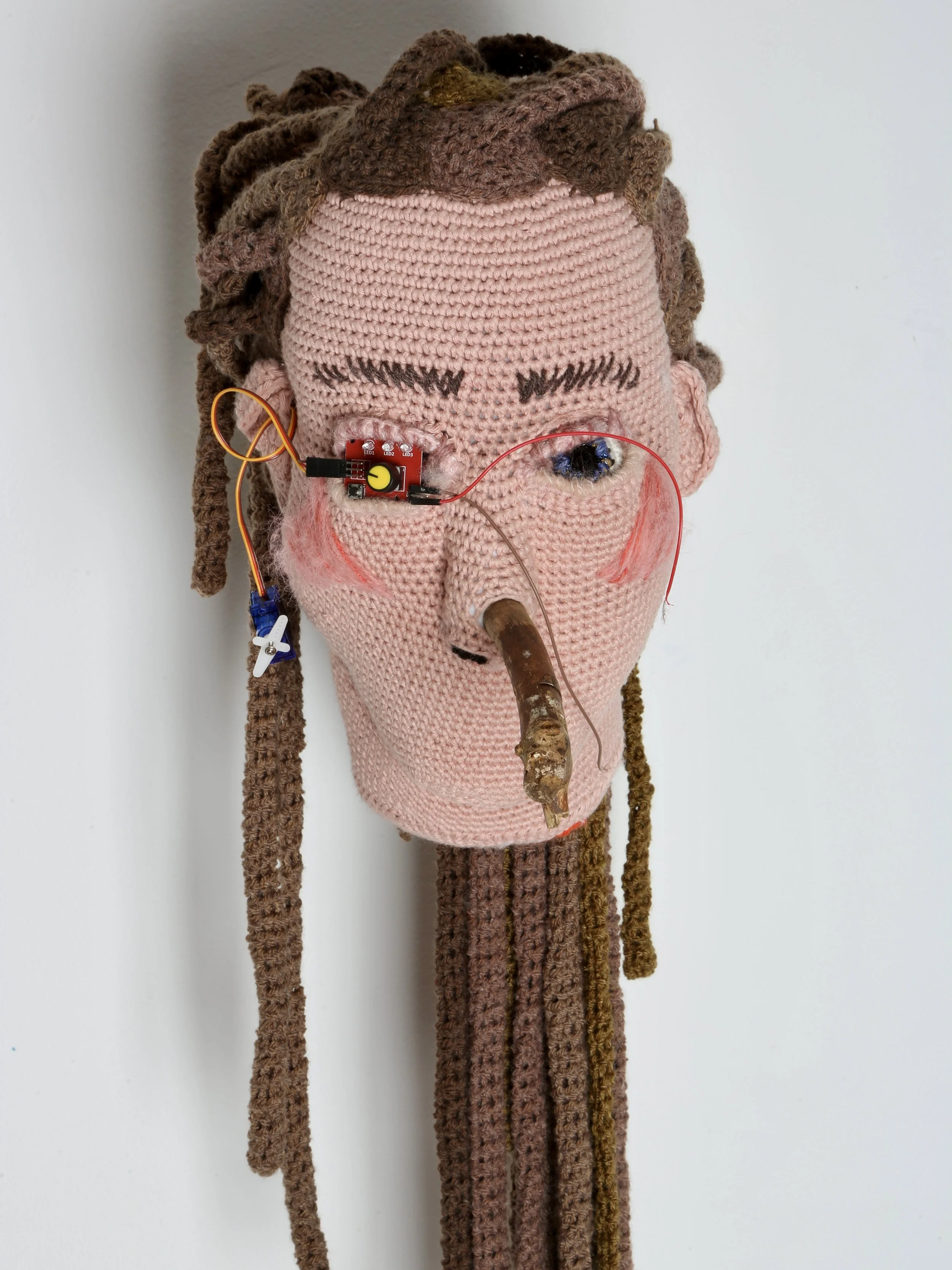  Tatum Kempers 
 SYSTEM SAYS NO
 Yarn (cotton, wool, acrylic, recycled plastic bottle yarn), teddy bear stuffing, electrical components, travo, tree branch
 approx. 80 × 25 cm