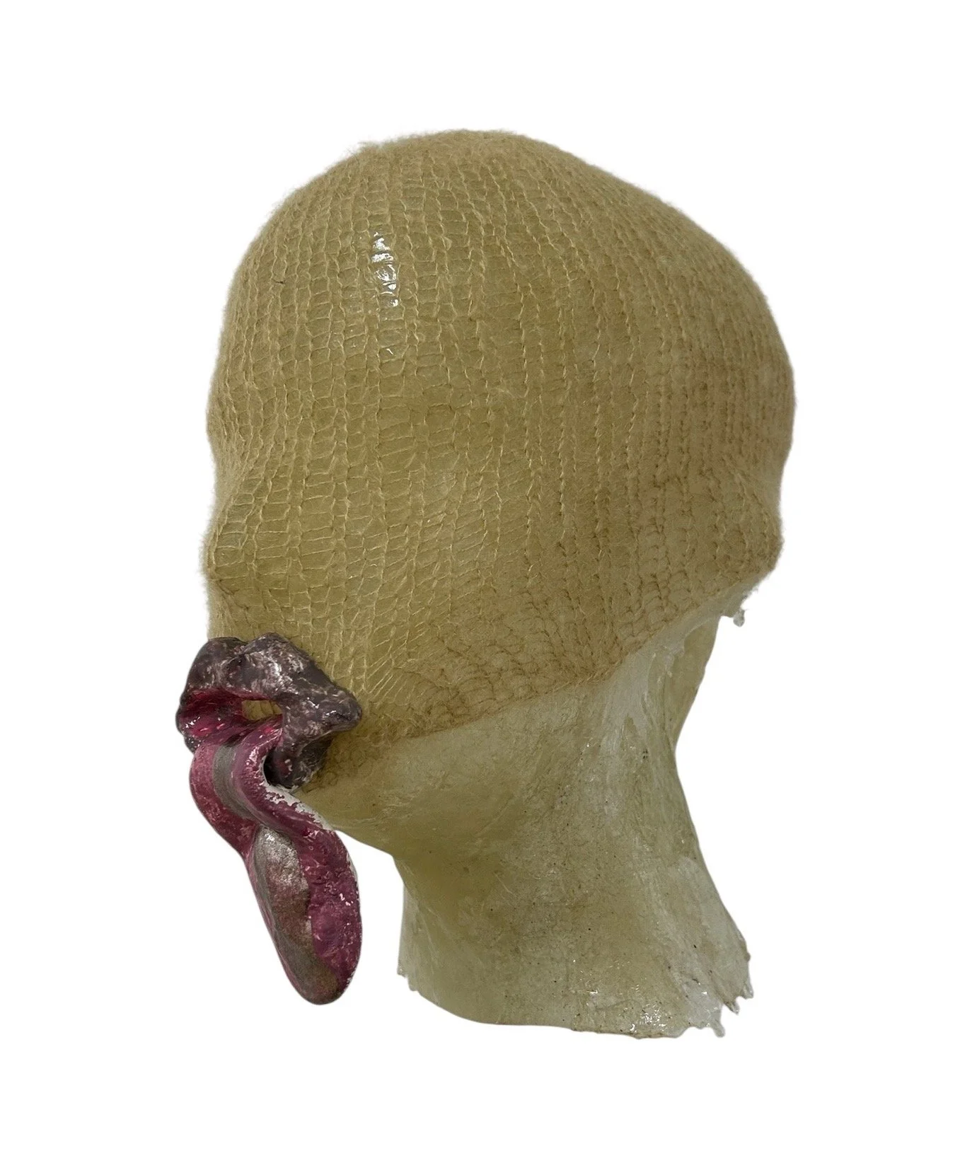  UNTILTED  
 Knitted mask
  27 X 17 X 23 cm 
 Mohair thread, varnished salt dough
 2025