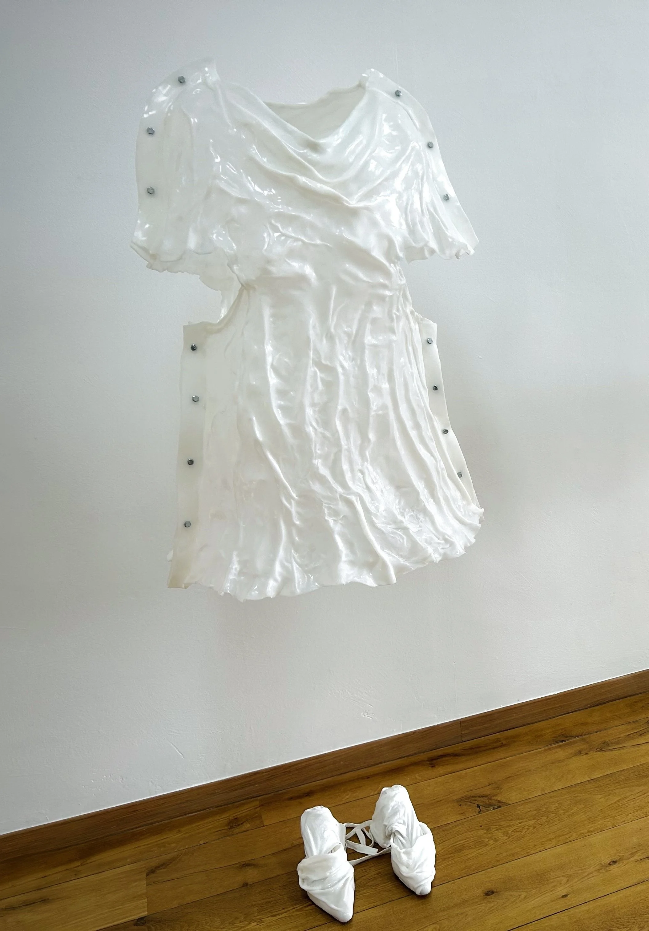  Lynn Van Hoydonck 
 SADNESS
 2024
 1 costume dress +1 pair of heels 
 75 x 100 cm
 Thermoplastic