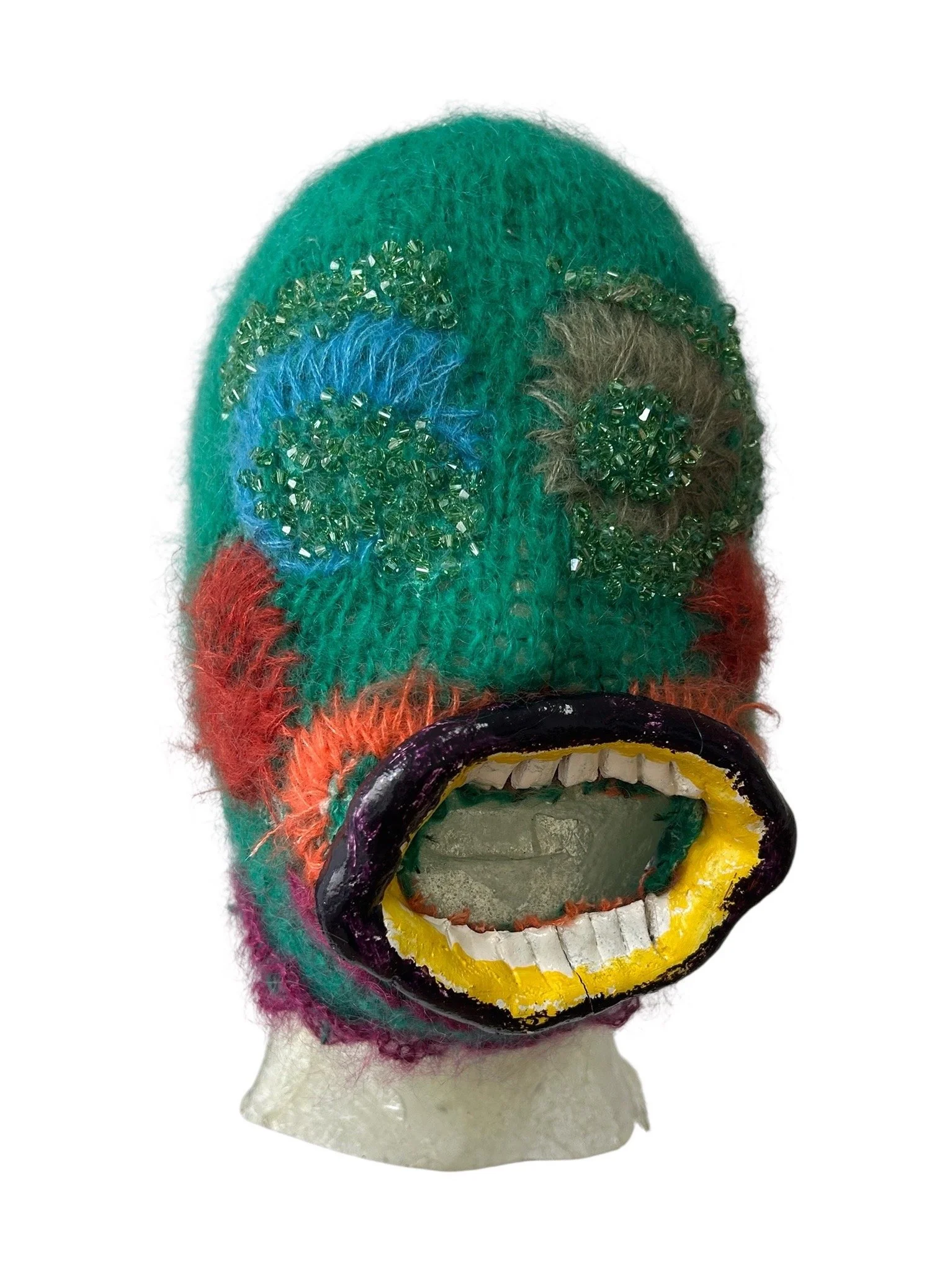  UNTILTED  
 Knitted mask
  27 X 17 X 23 cm 
 Alpaca thread, varnished salt dough,
Svarowski crystals
 2025