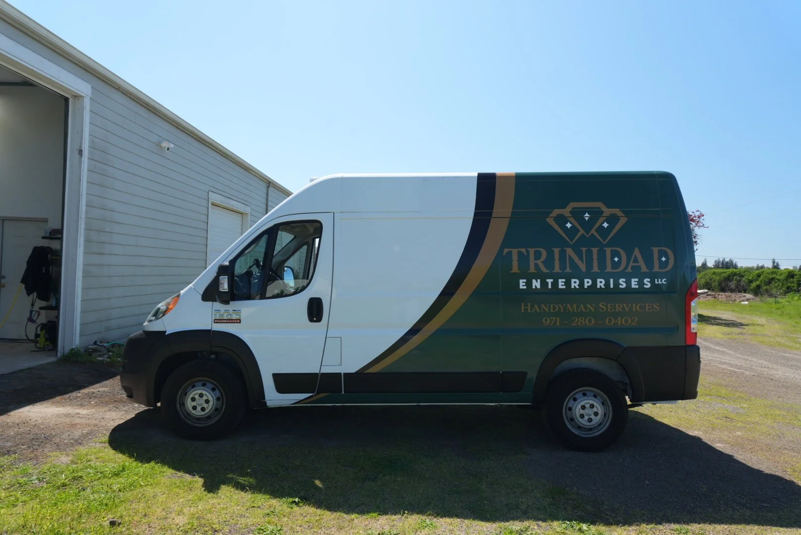 white service can with classic swoop wrap design for construction company includes green swoop with black and gold accents and large gold diamond logo that reads Trinidad Enterprises, wrapped by Codered Racing in salem oregon who does wraps