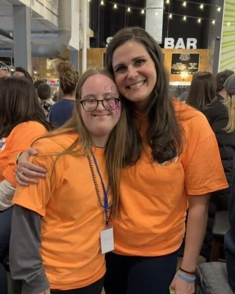 "I volunteer at 3.21 for my former students, their incredible families, and to spread kindness and perspective. My favorite part of 3.21 is first thing in the morning when the buses pull in, packed with VIPs. Their arrival symbolizes the arrival