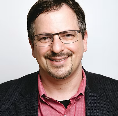 Photo of Jesse Berger smiling at the camera