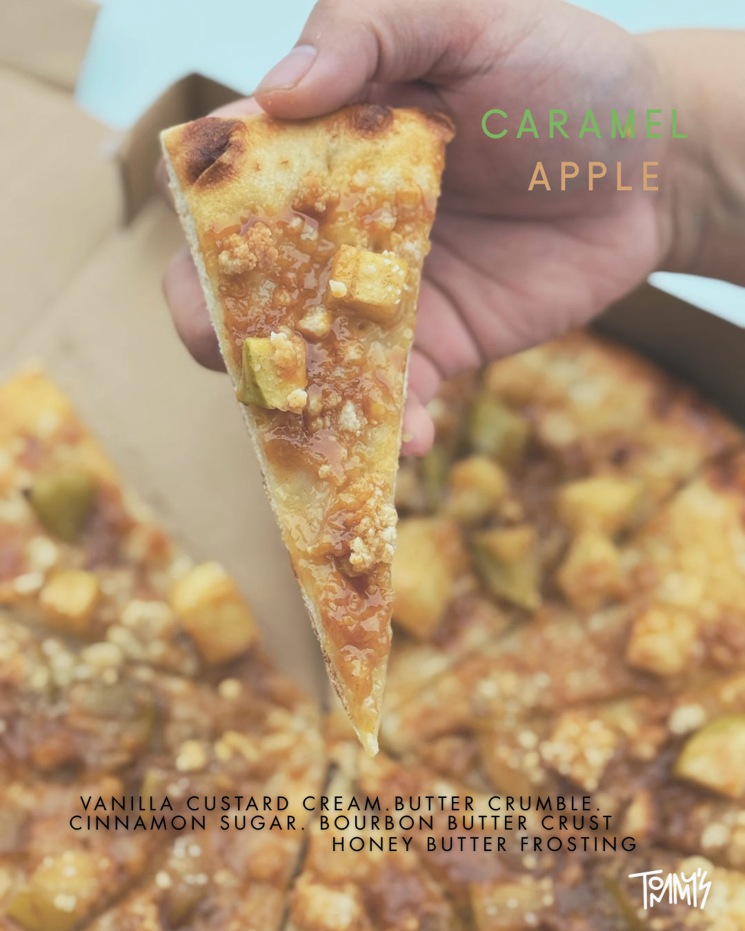 Slice of Caramel Apple dessert pizza featuring baked apples, cinnamon crumble, and caramel sauce.