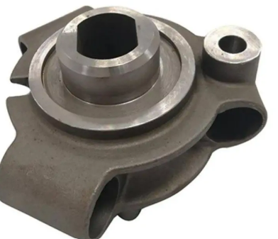 Metal mechanical part with circular openings and a protruding shaft.