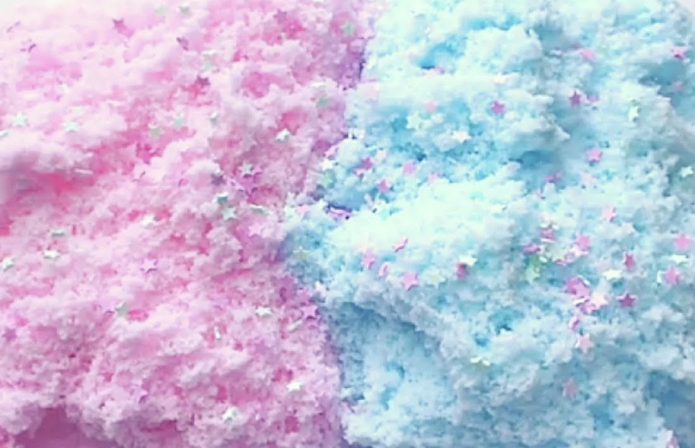 Pink and blue cotton candy with star-shaped sprinkles.