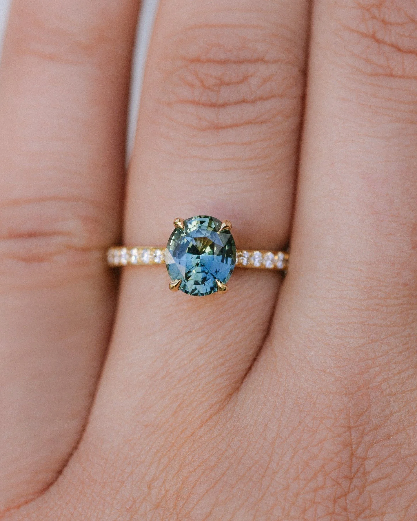 A solitaire, reimagined.⁠
⁠
This one-of-a-kind ring features a natural teal sapphire from Madagascar, held in talon claws with diamond shoulders that taper for balance.⁠
Classic at first glance, but with a modern edge that makes it entirely its own.⁠