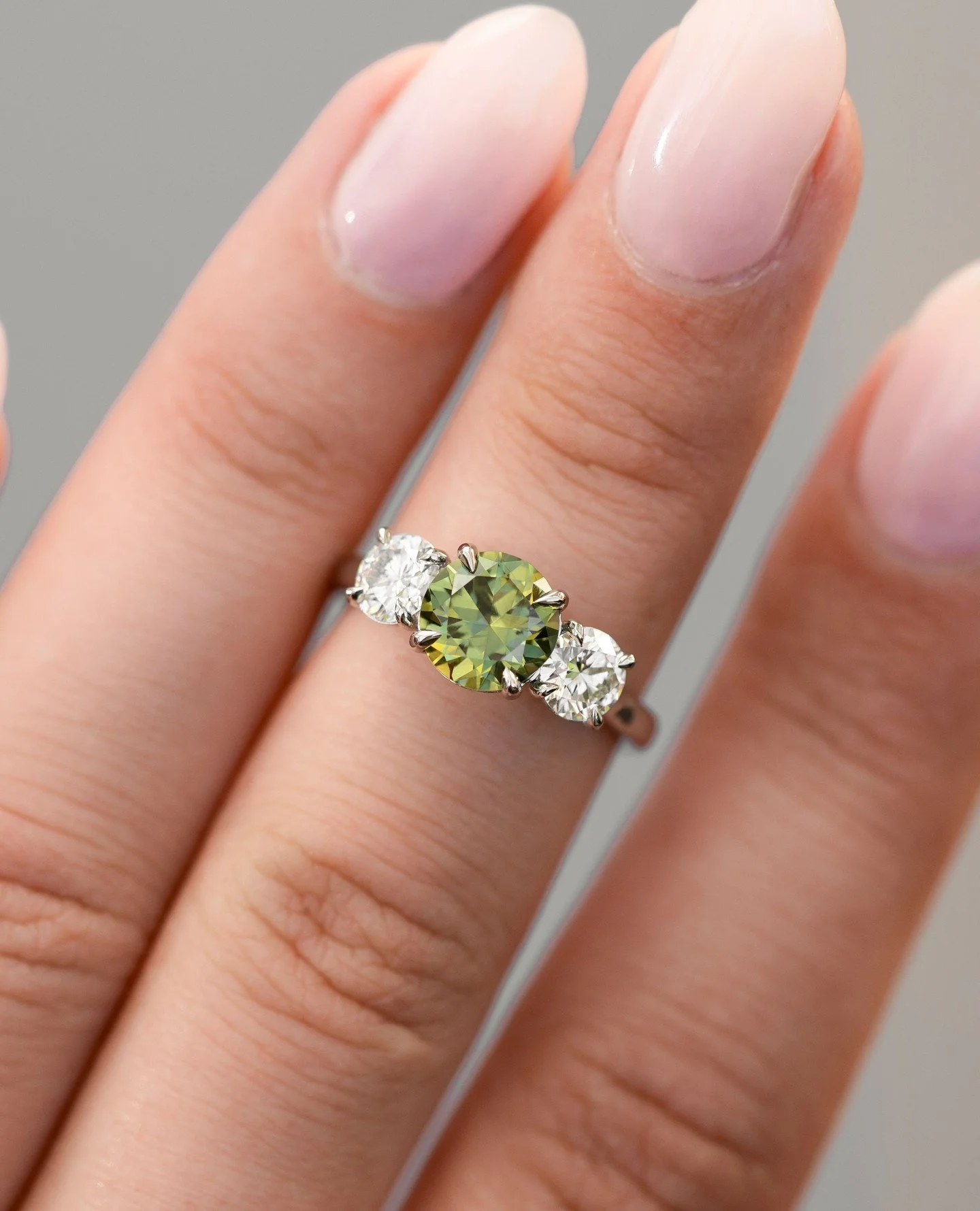 For Daniel &amp; Sinead.⁠
⁠
Custom platinum trilogy with a bright green Australian sapphire at the centre &mdash; Sinead&rsquo;s favourite colour, which made the choice feel easy.⁠
⁠
Classic three-stone design. Crisp platinum. And a centre stone that
