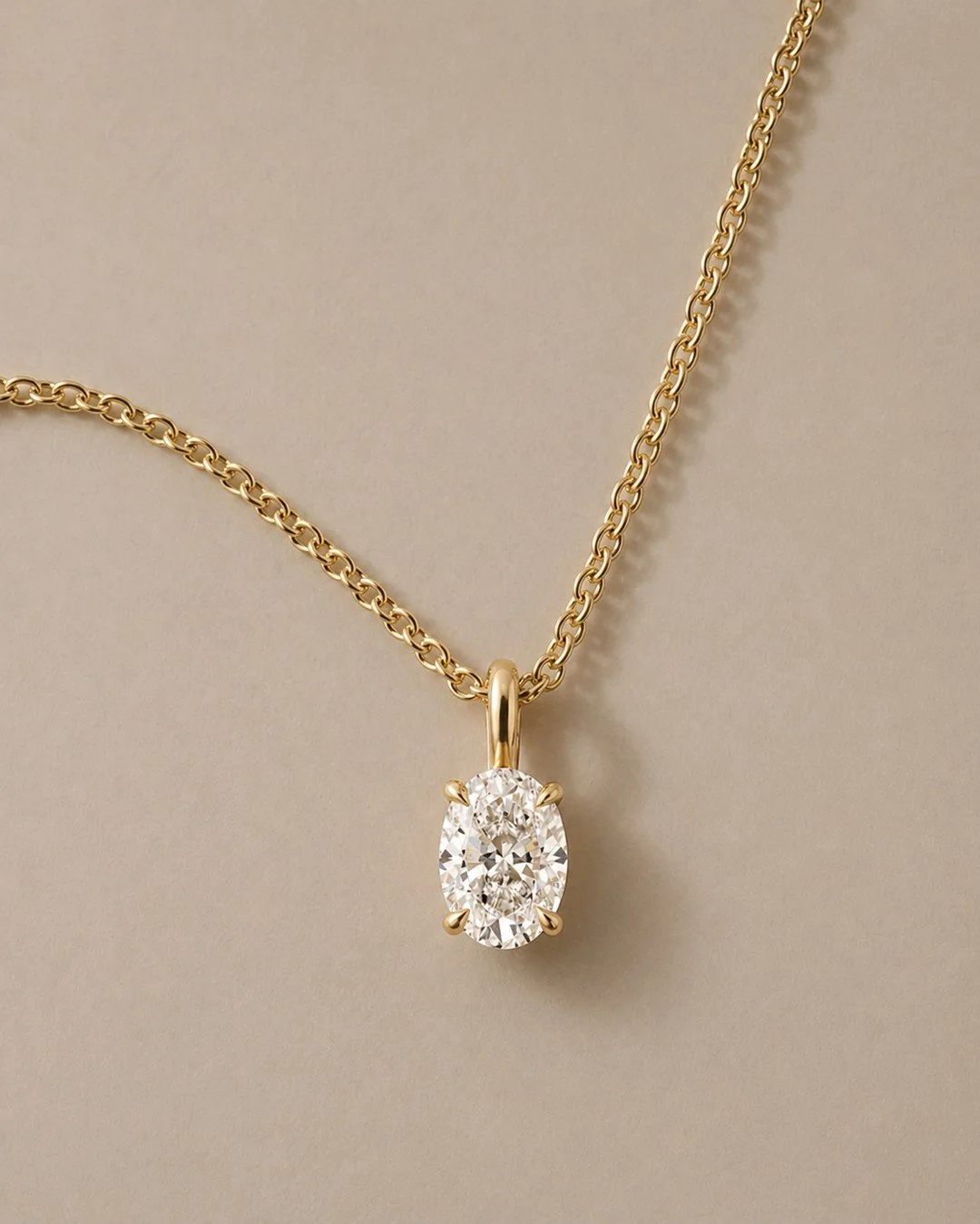 A 1ct oval lab-grown diamond, held in a talon claw setting and suspended from a 1.5mm trace chain. Special enough to feel like a moment, timeless enough to become part of your every day.