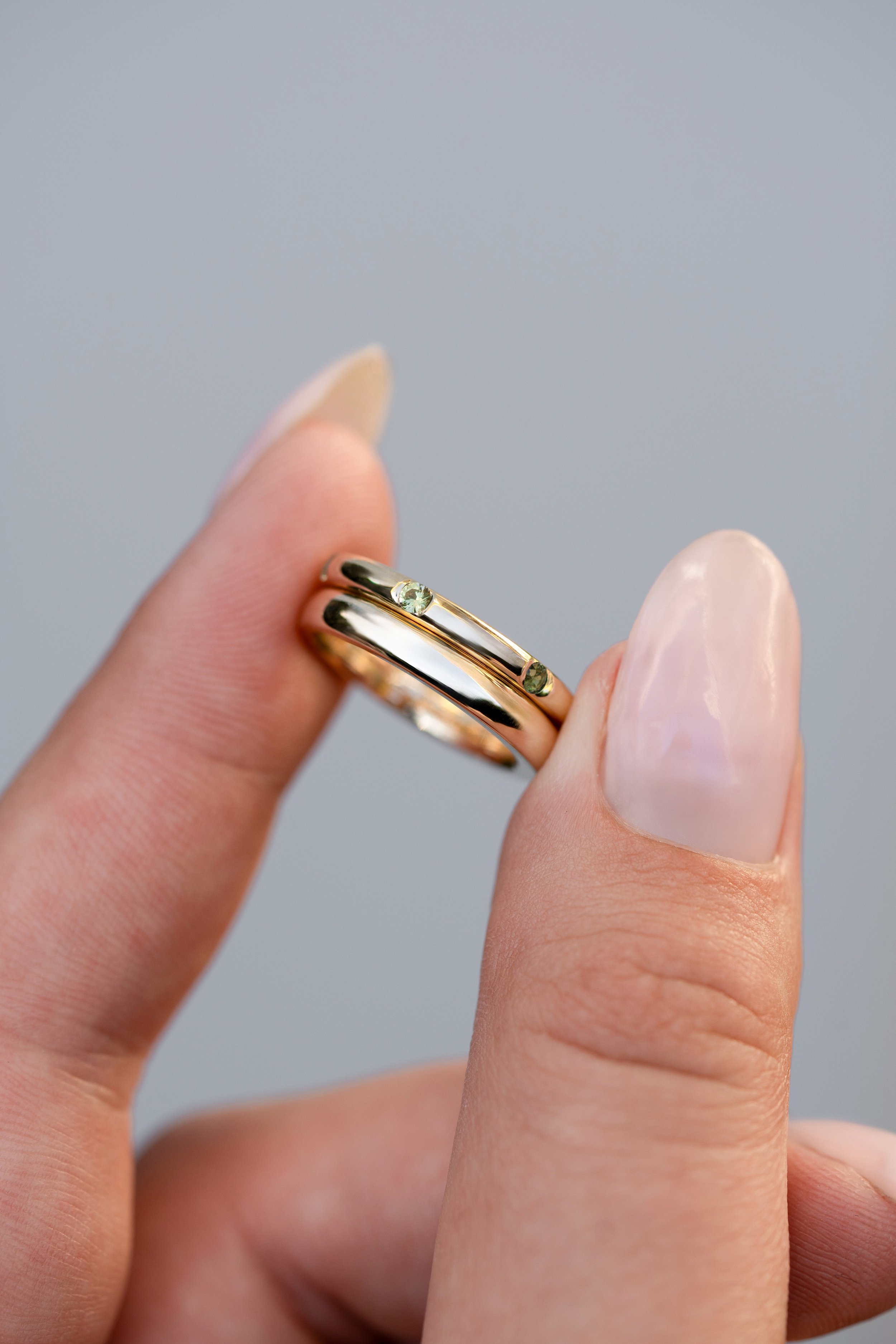 Custom wedding band set with wild to ware hand fossicked green and yellow sapphires