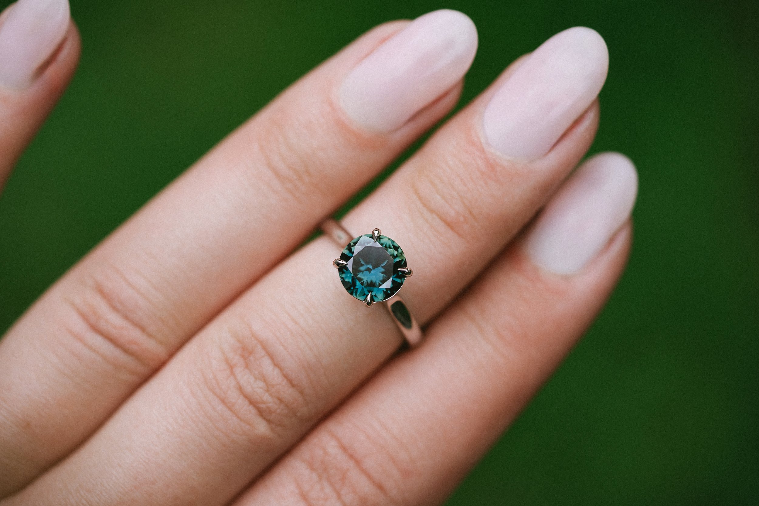 Australian Teal Sapphire Platinum solitaire