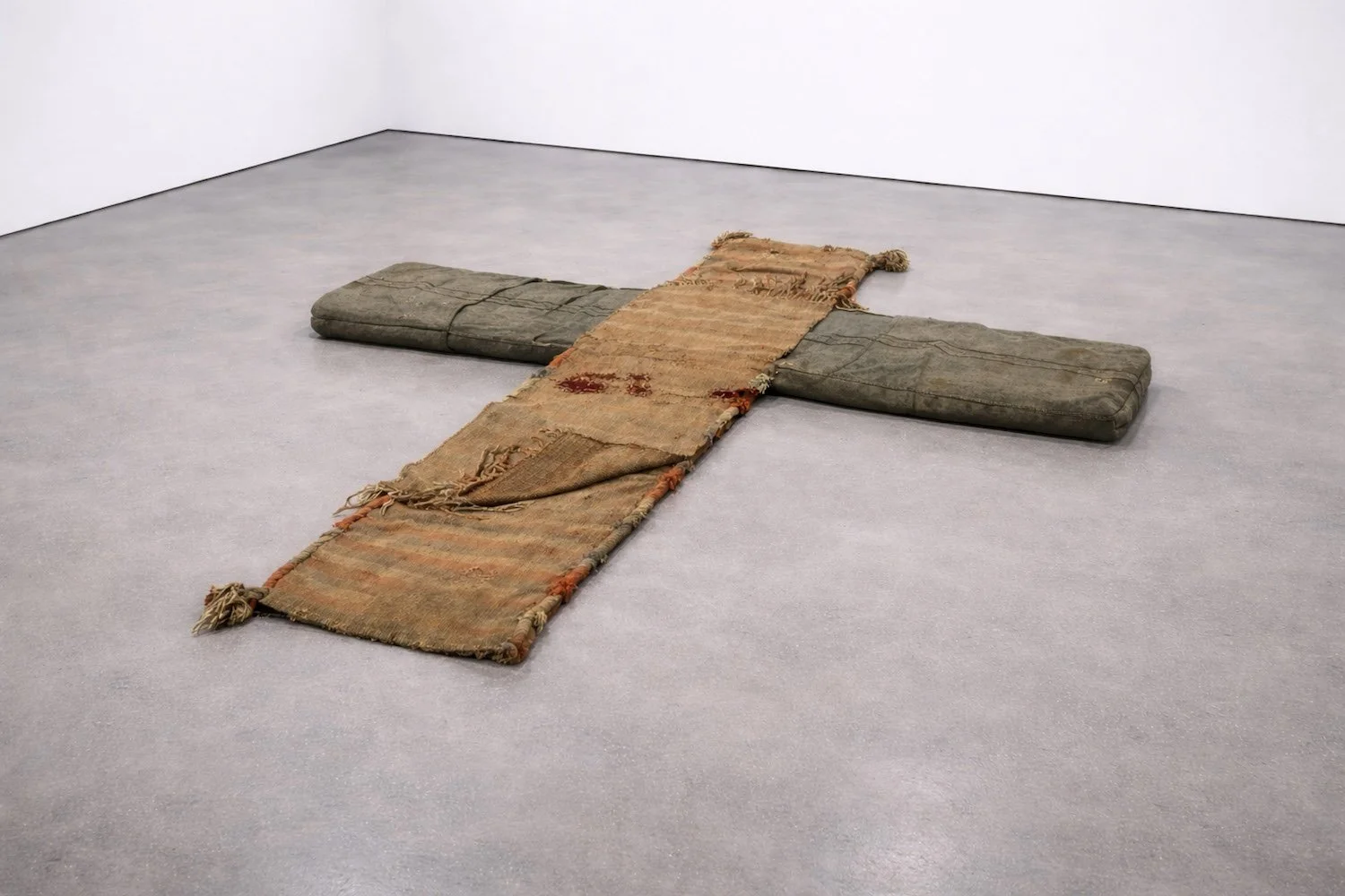 Load,
135 × 90 cm, 2026,
Found saddlebags, reclaimed fabric, cotton thread, 
AI-generated image