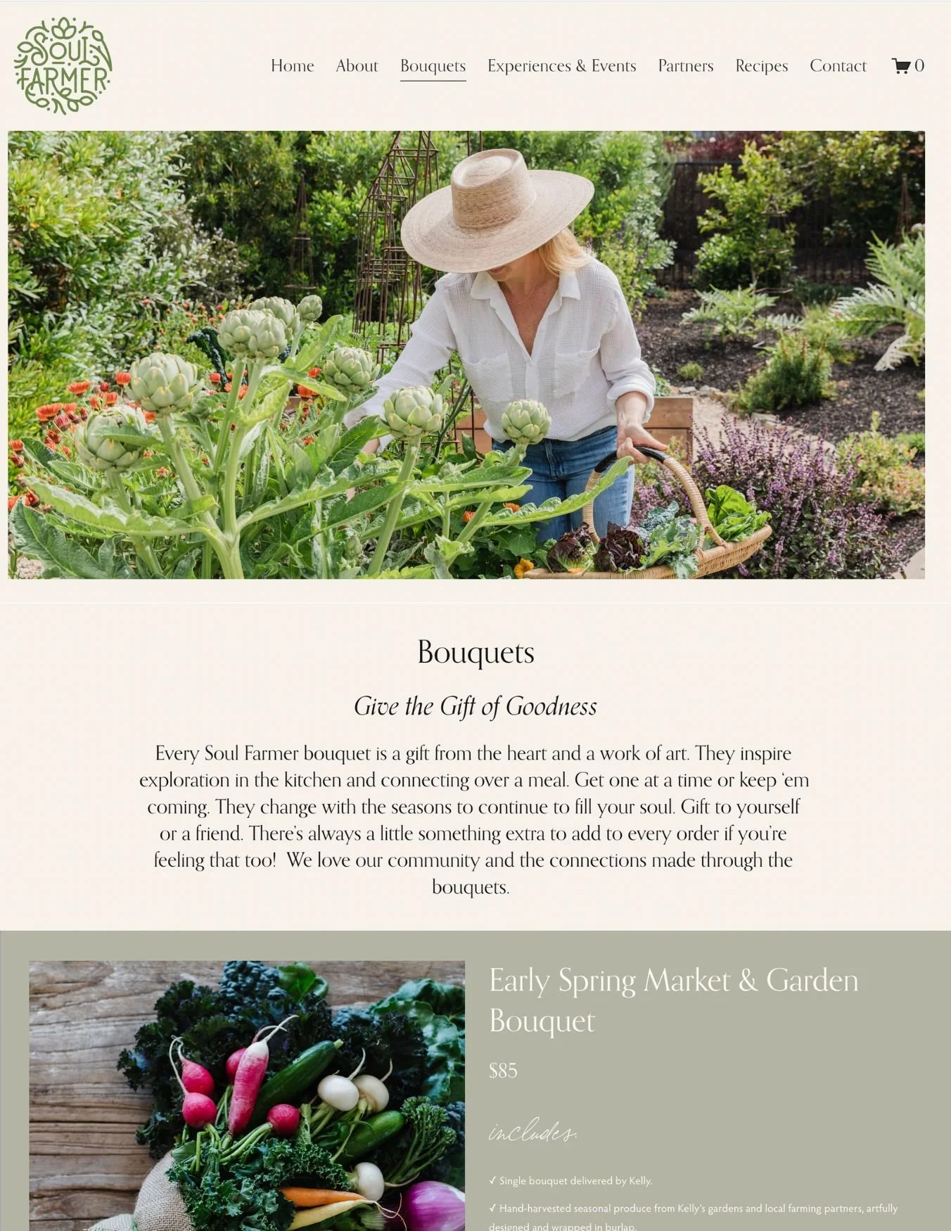 A woman in a wide-brimmed hat and white shirt tending to artichokes and other vegetables in a lush garden.