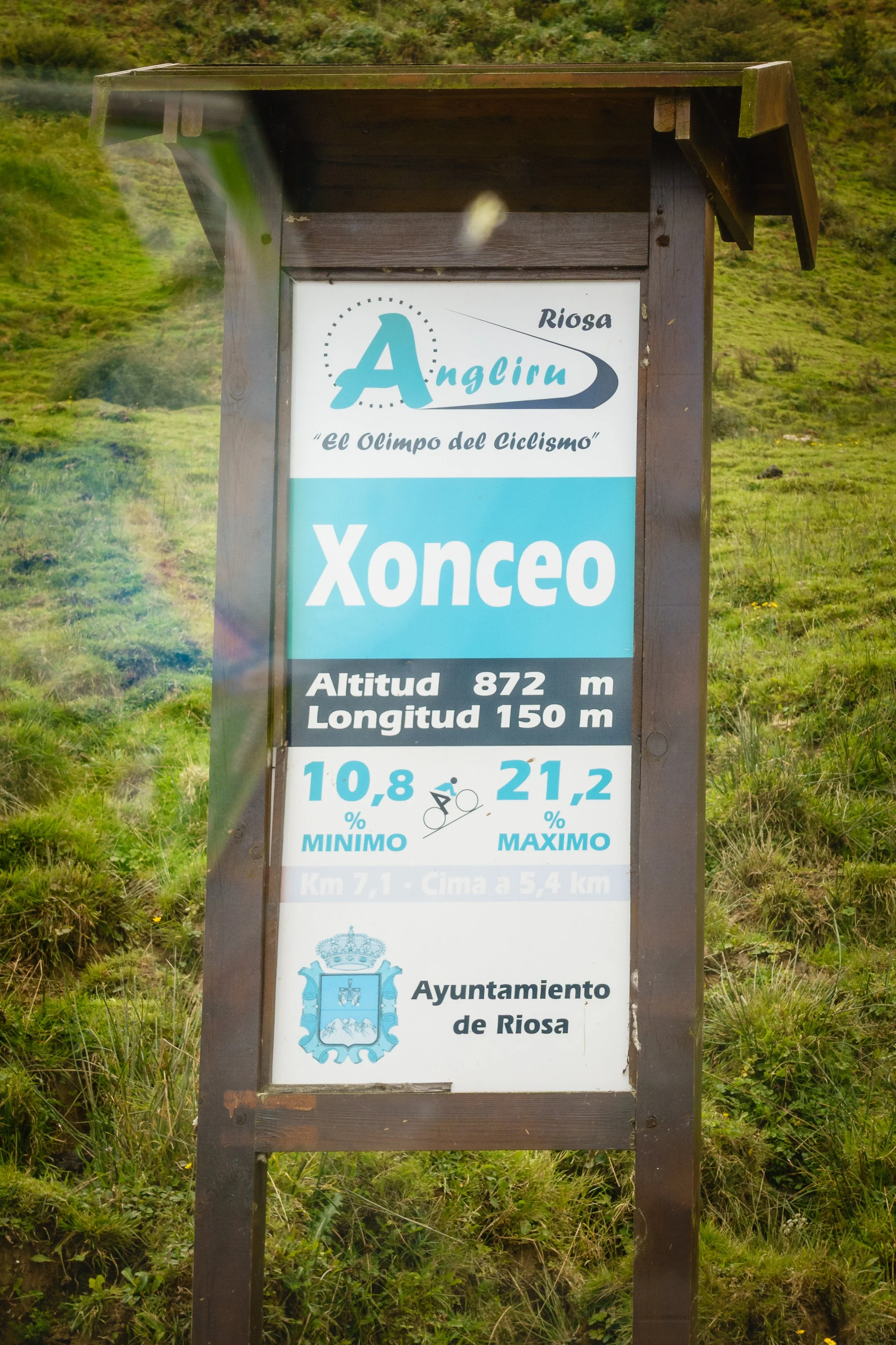 Signboard with cycling data and elevation info at Xonceo in Riosa, Spain.