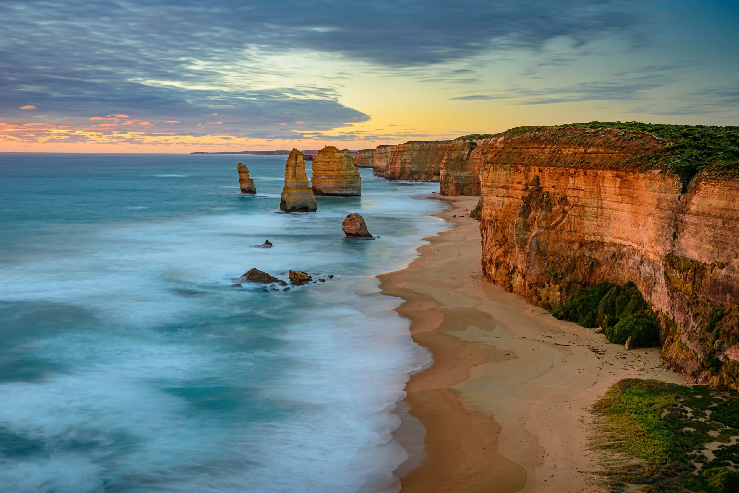 Long exposure bathes cliffs of 12 apostles in golden hour sunset light | 12 Apostles | Great Ocean Road | Sunset | Long exposure | Brisbane landscape and travel photographer Ralph McConaghy