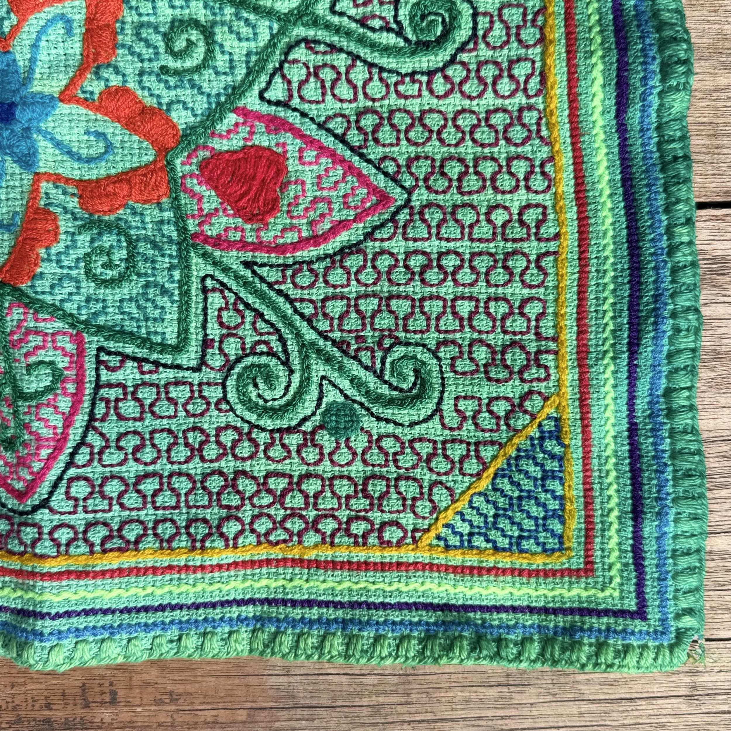 handmade-peruvian-shipibo-altar-cloth-green-floral-embroidery-detail.jpeg