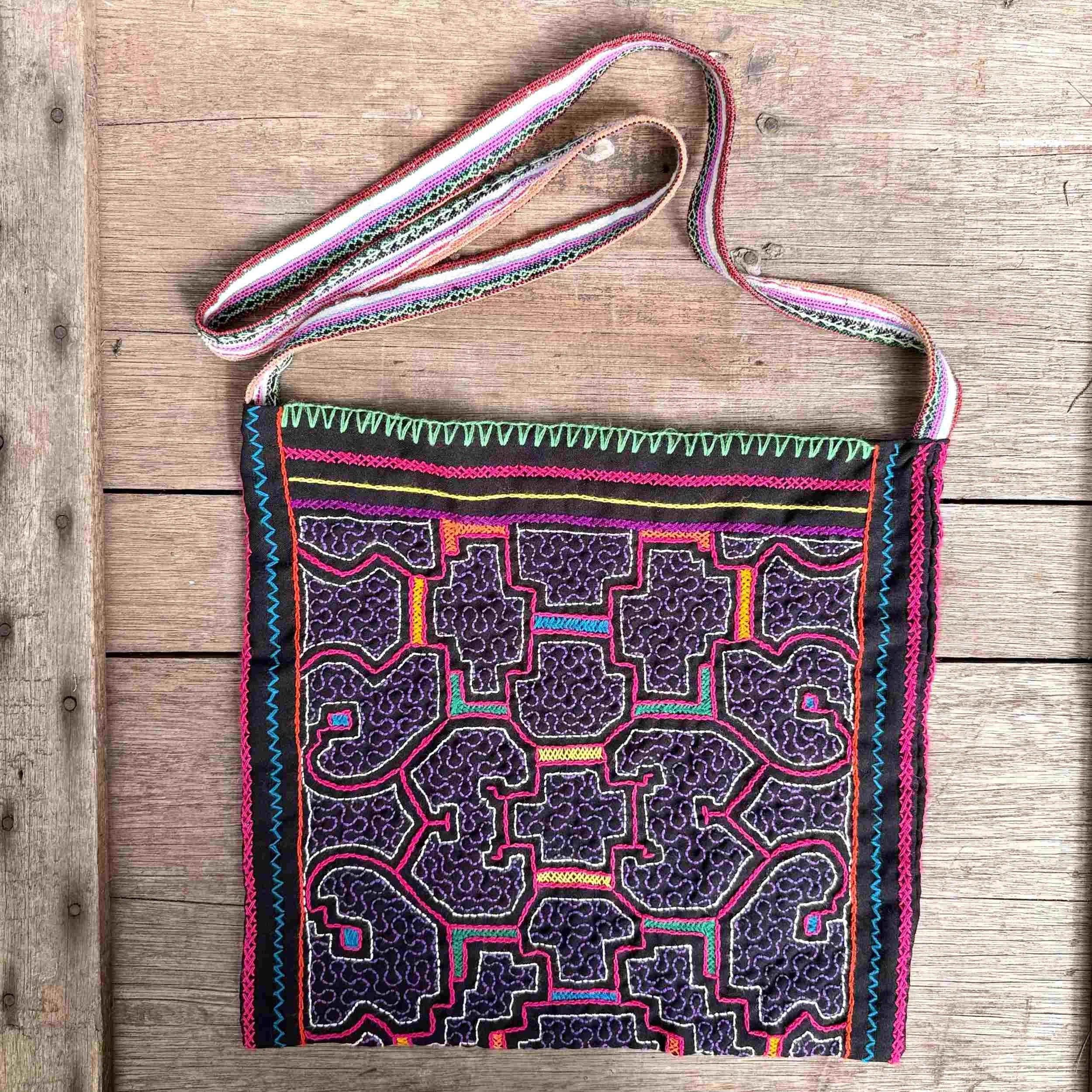 nine-handmade-peruvian-embroidered-bag-black-pink-pattern-detail.jpg