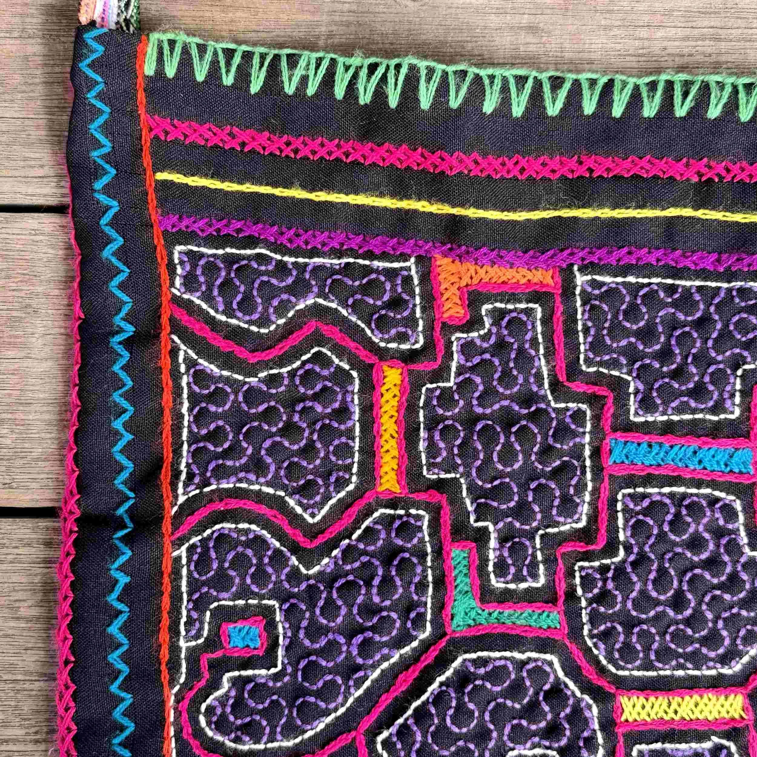 nine-handmade-peruvian-embroidered-bag-black-purple-pattern-detail.jpg